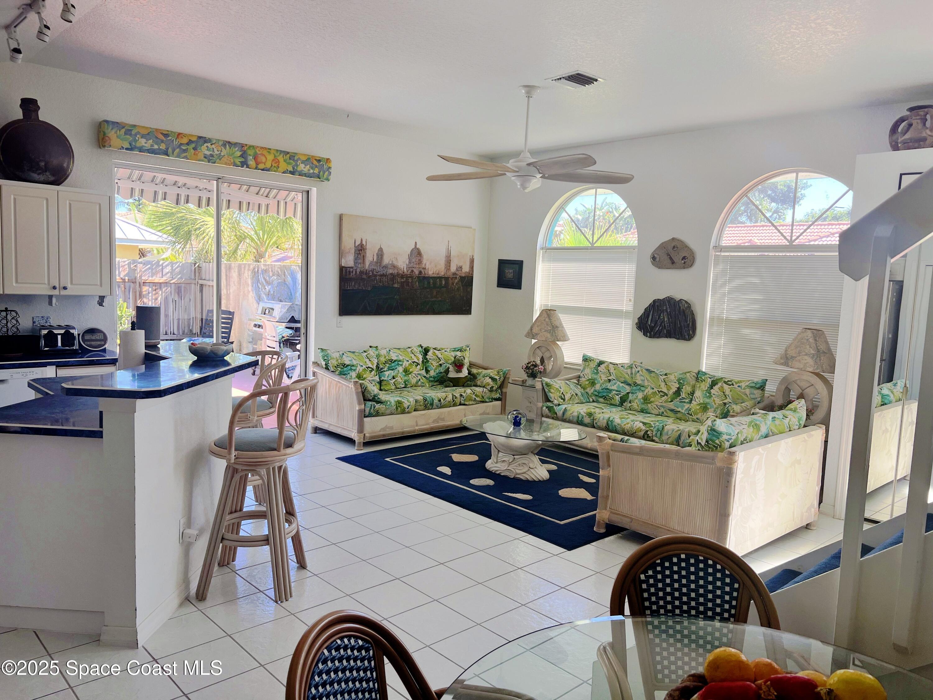150 Sandy Shoes Drive Melbourne Beach, FL 32951 - Photo 11 of 31 a living room with fireplace furniture and a potted plant