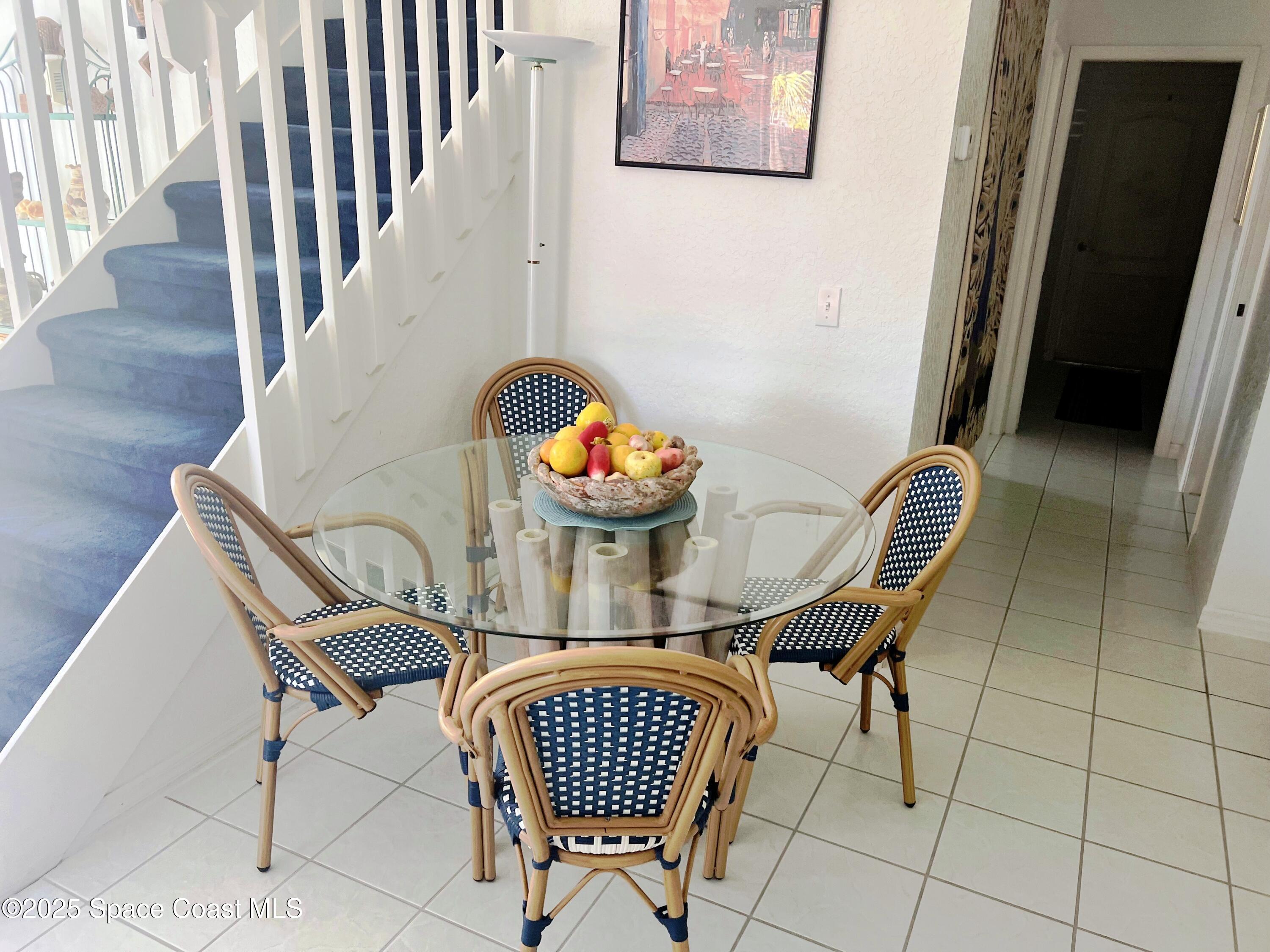 150 Sandy Shoes Drive Melbourne Beach, FL 32951 - Photo 14 of 31 a dining room with furniture and wooden floor