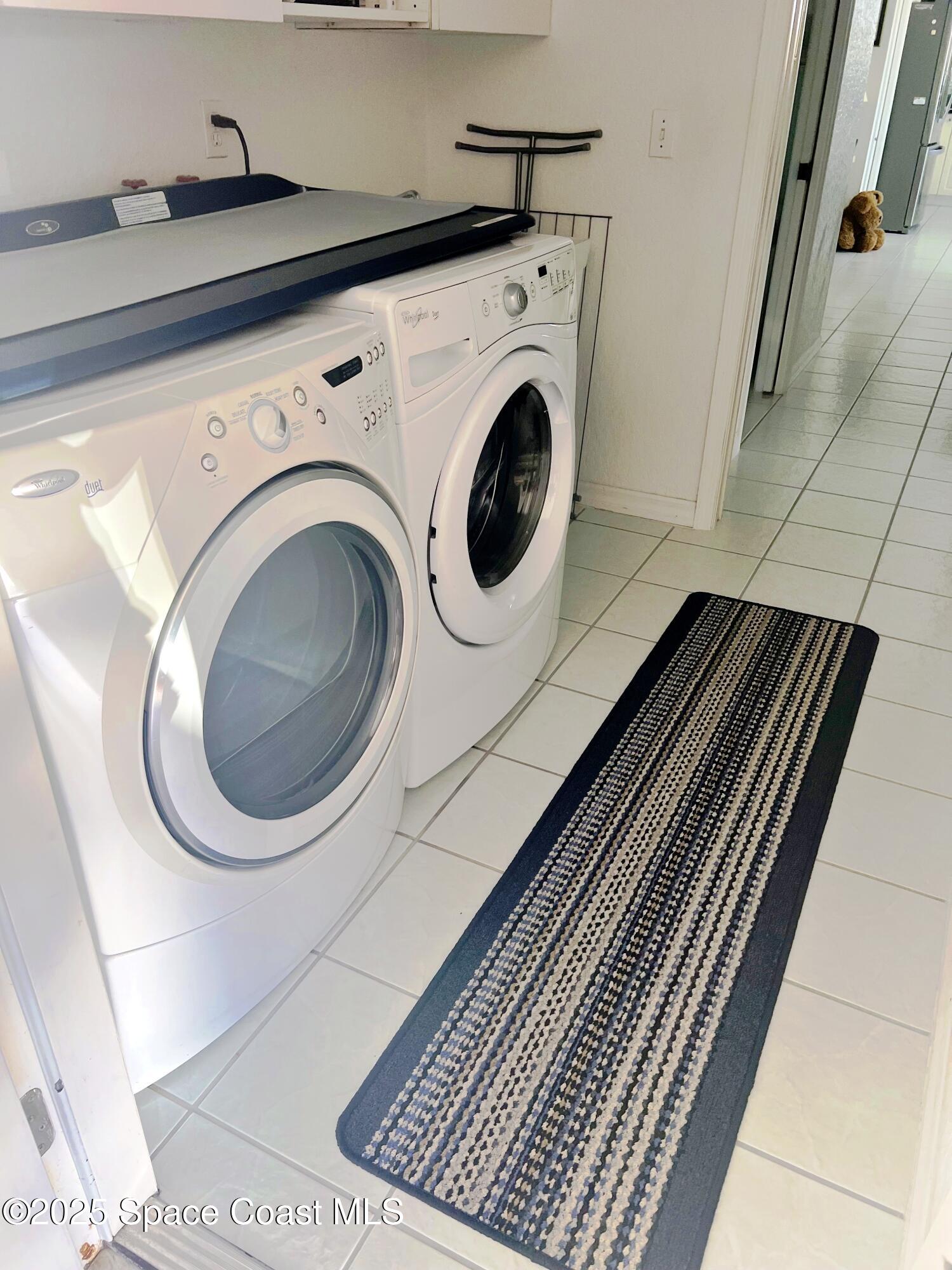 150 Sandy Shoes Drive Melbourne Beach, FL 32951 - Photo 18 of 31 a close up view of a washer and dryer