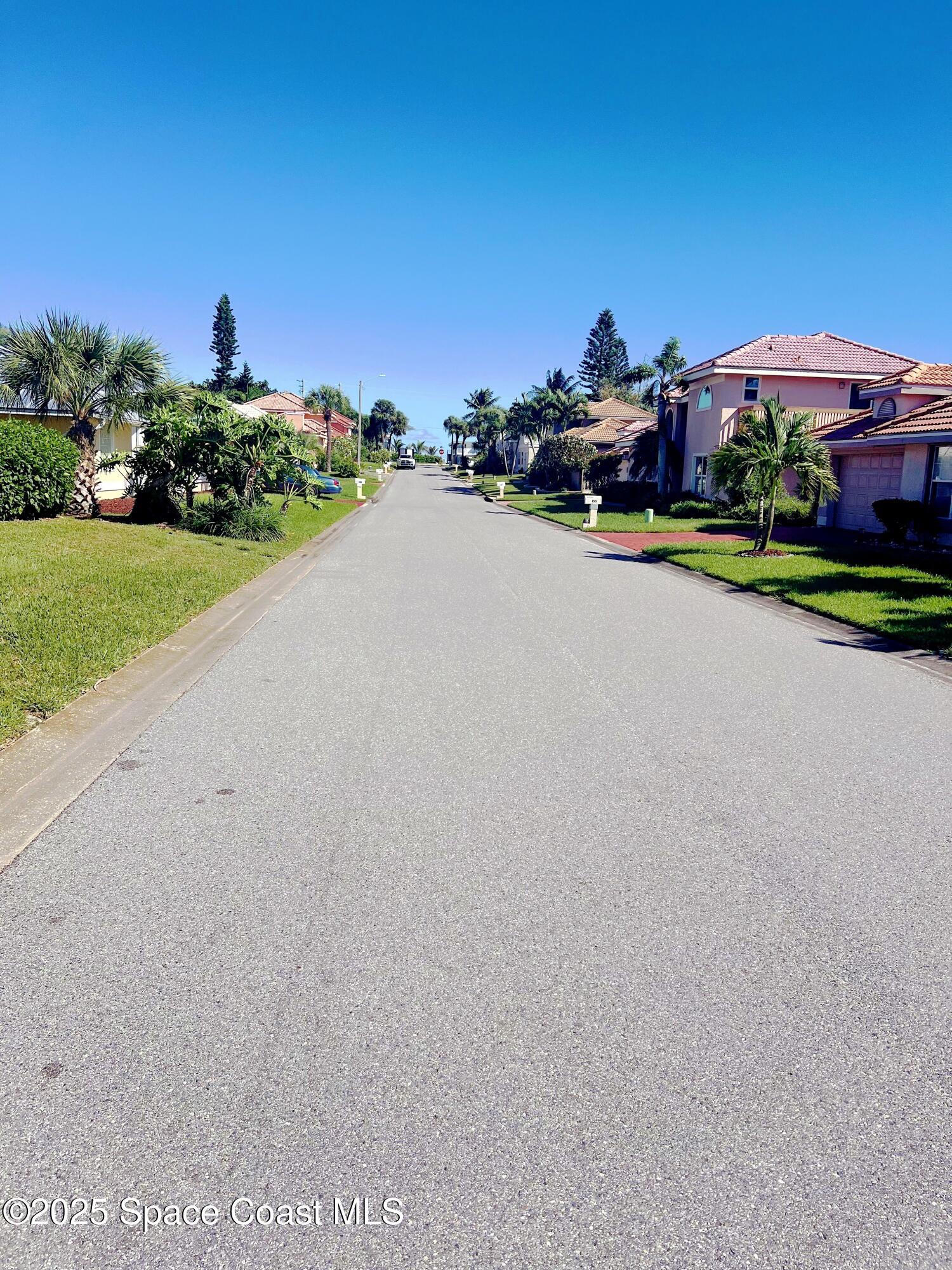 150 Sandy Shoes Drive Melbourne Beach, FL 32951 - Photo 2 of 31 a view of a street with a houses