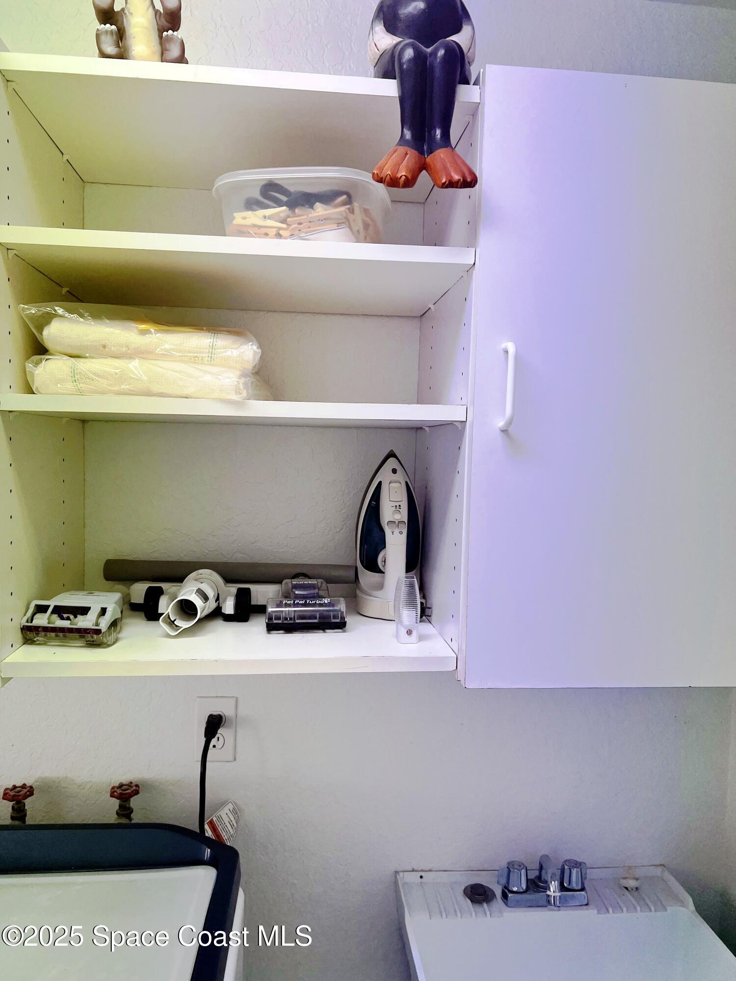 150 Sandy Shoes Drive Melbourne Beach, FL 32951 - Photo 31 of 31 a kitchen with a stove and cabinets