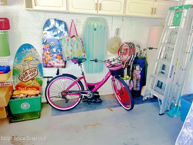 a kitchen with stainless steel appliances granite countertop a sink and a refrigerator