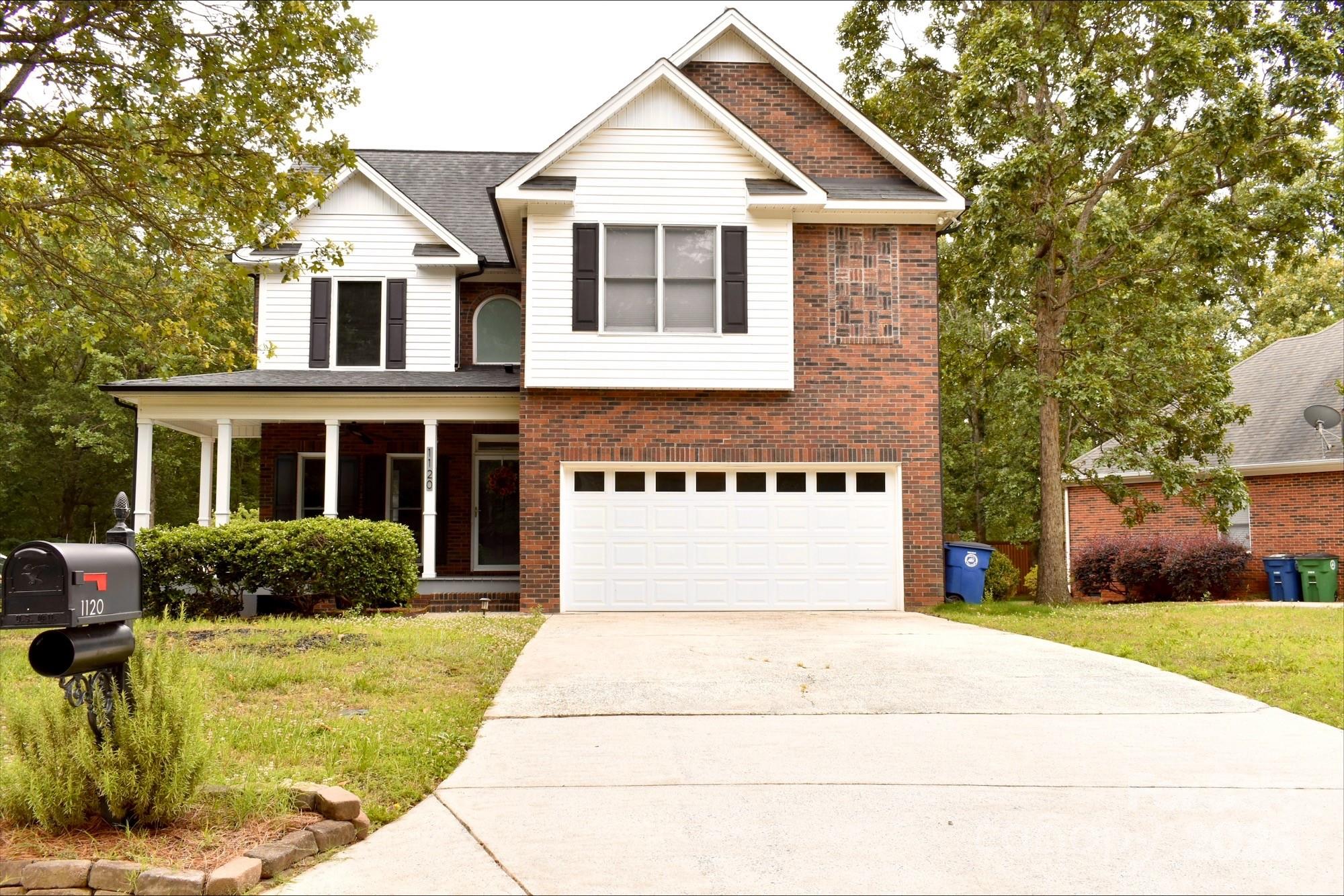 1120 Millwright Lane Matthews, NC 28104 - Photo 1 of 41 a front view of a house with a yard