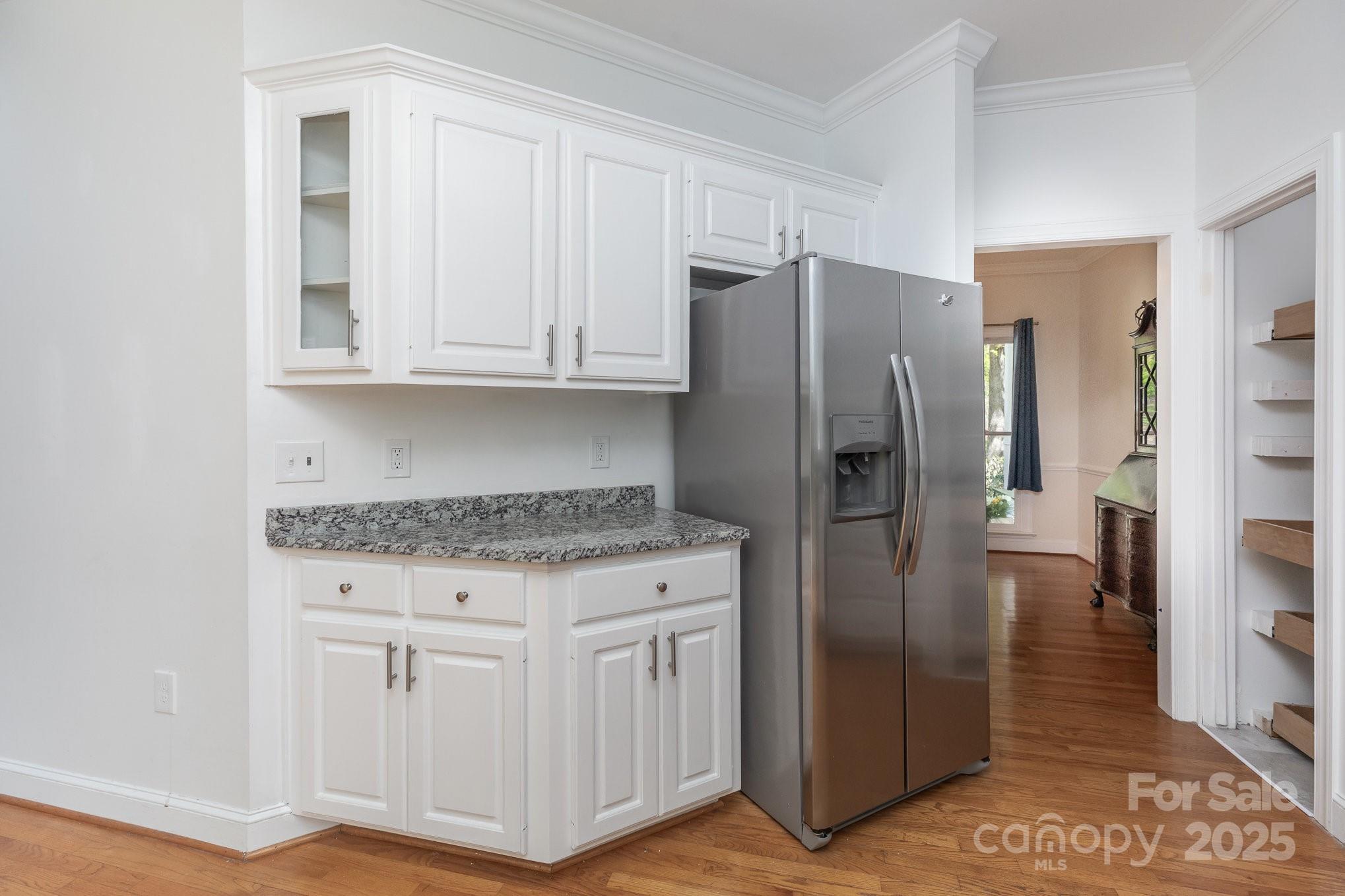 1120 Millwright Lane Matthews, NC 28104 - Photo 14 of 41 a kitchen with stainless steel appliances granite countertop a refrigerator and a stove
