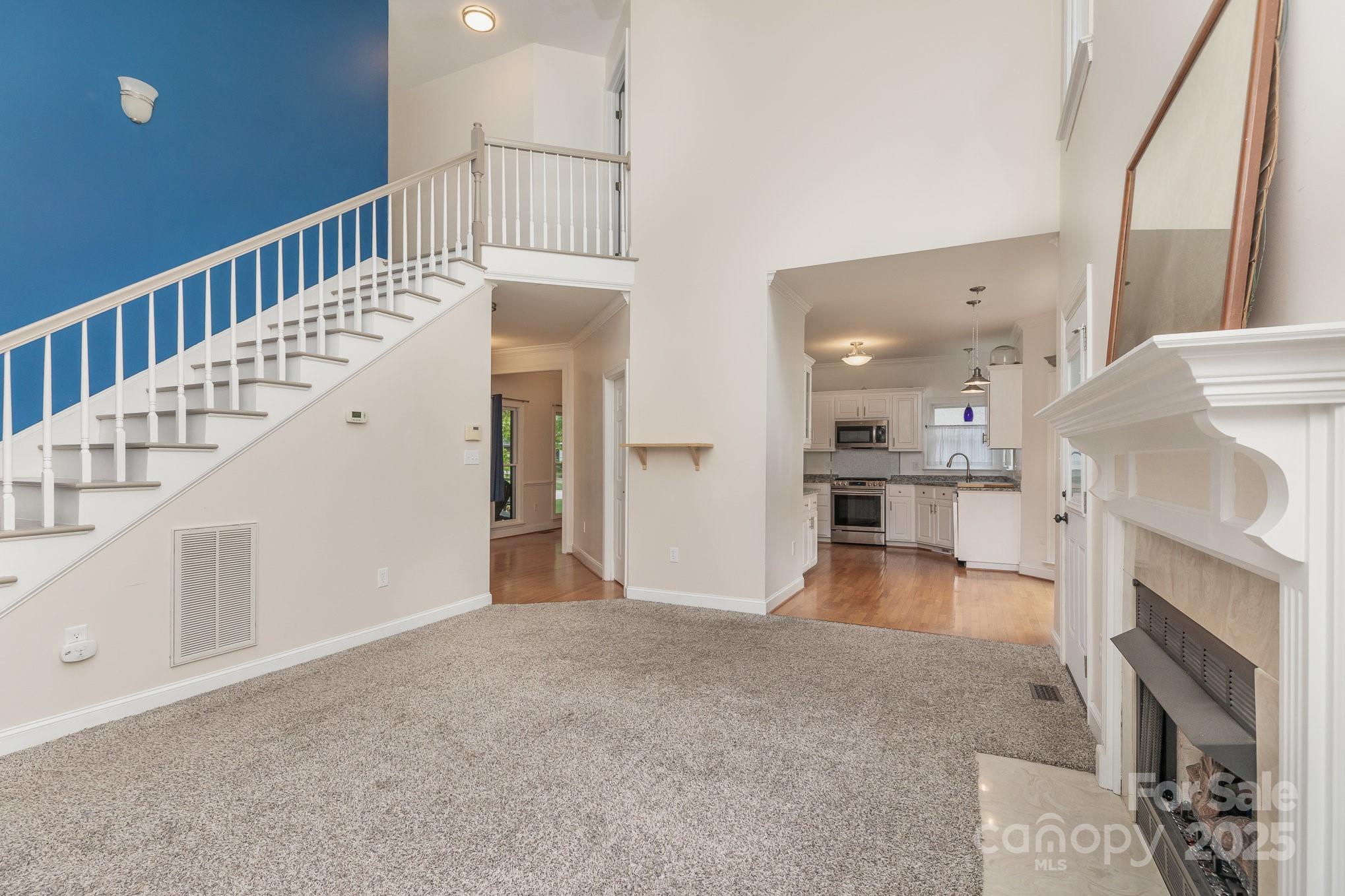 1120 Millwright Lane Matthews, NC 28104 - Photo 8 of 41 a view of entryway and hall with wooden floor