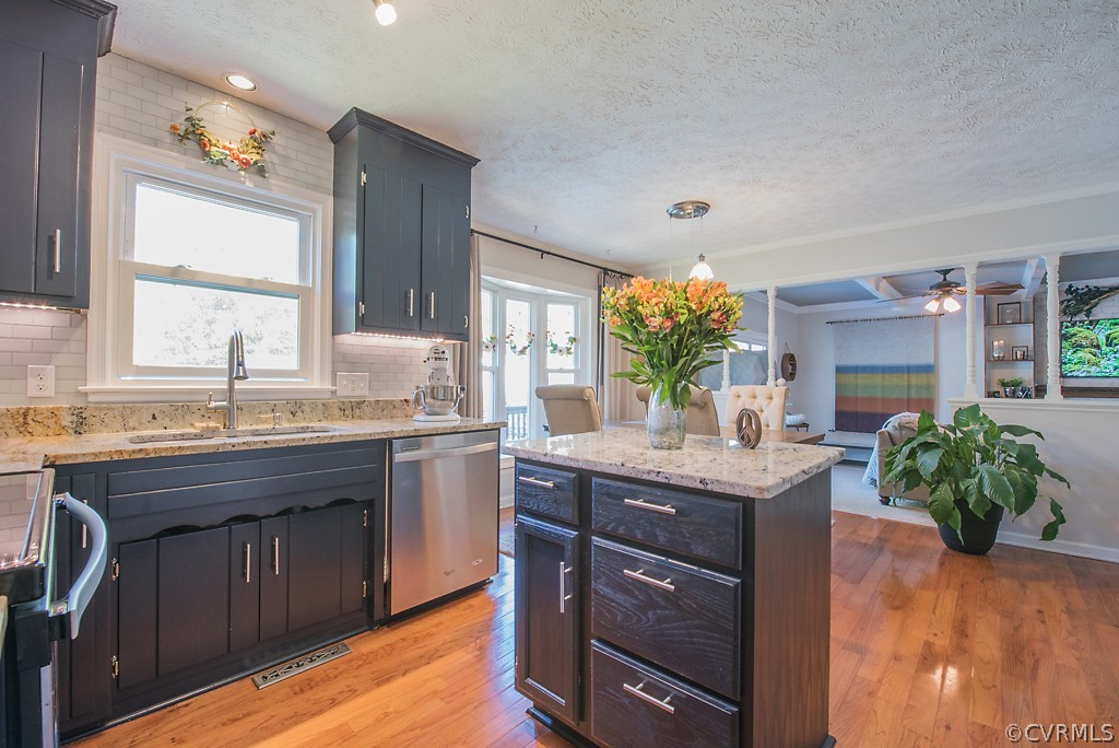 1532 Austin Road Chester, VA 23836 - Photo 11 of 50 a kitchen with granite countertop a sink potted plant and a large window