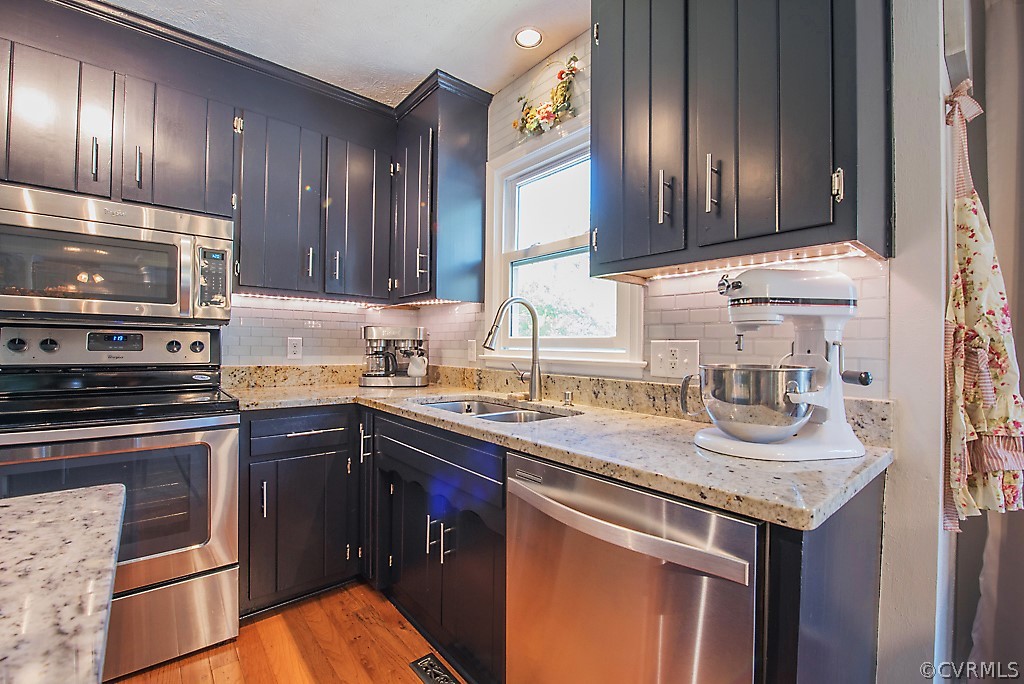 1532 Austin Road Chester, VA 23836 - Photo 13 of 50 a kitchen with granite countertop a sink stove and cabinets