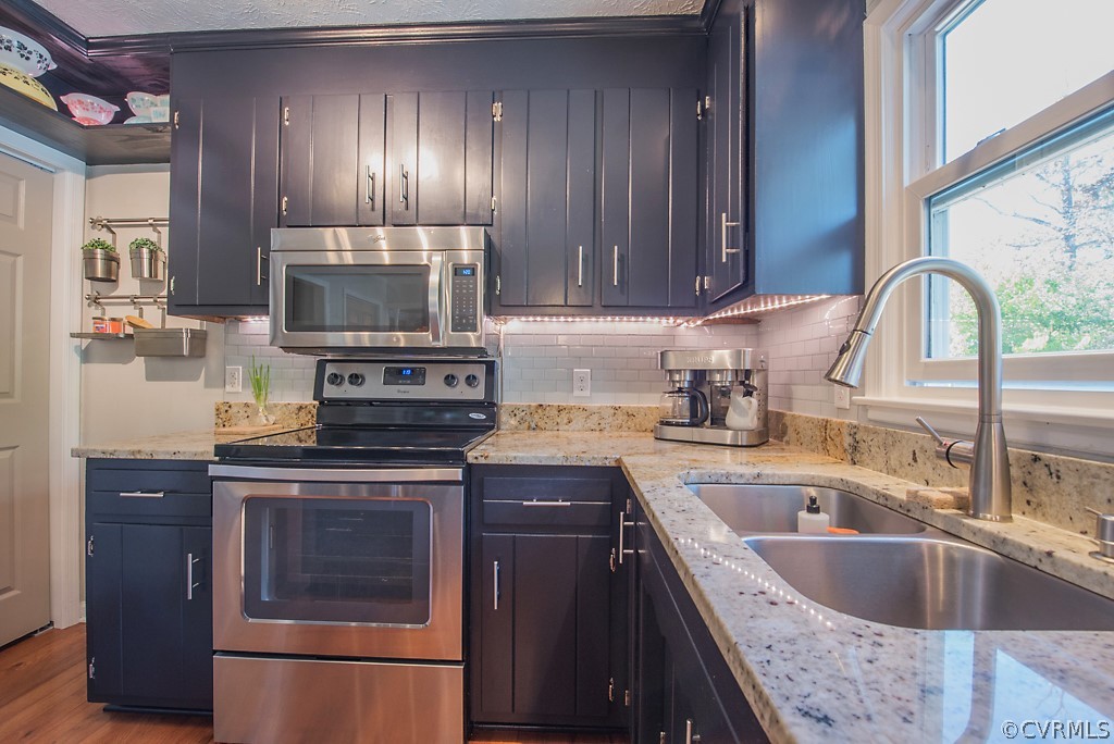 1532 Austin Road Chester, VA 23836 - Photo 15 of 50 a kitchen with a sink stove and refrigerator