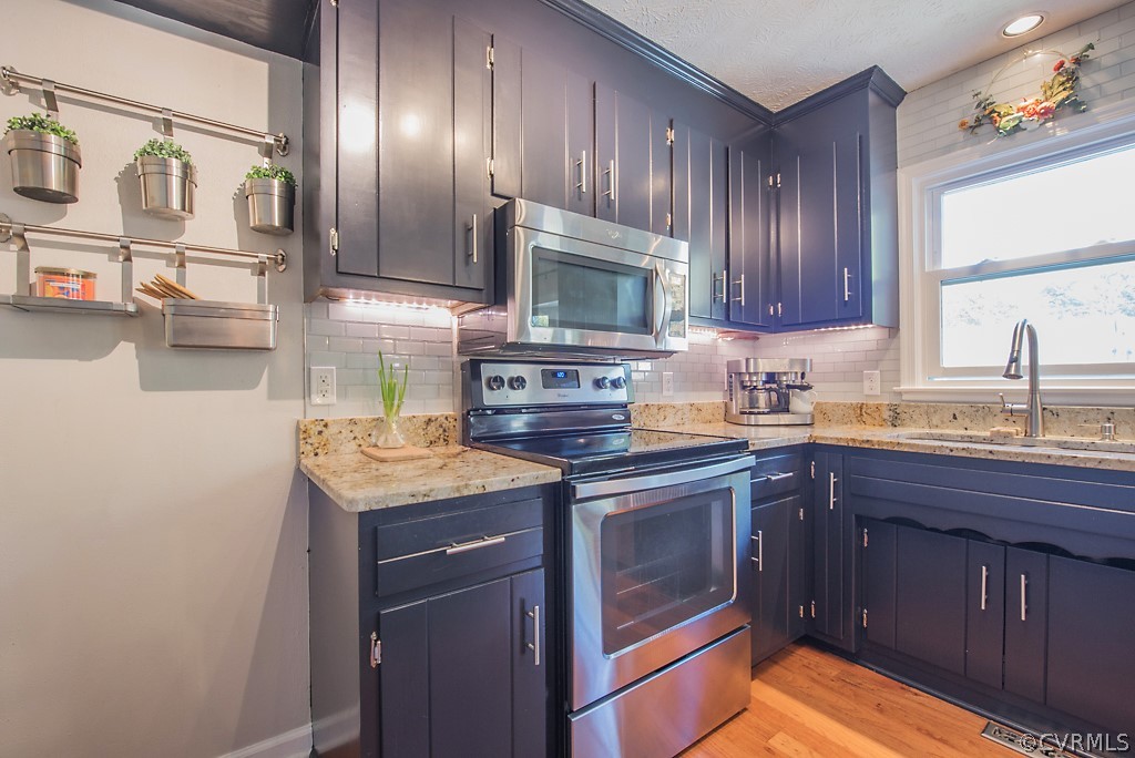 1532 Austin Road Chester, VA 23836 - Photo 17 of 50 a kitchen with stainless steel appliances granite countertop a sink stove and cabinets