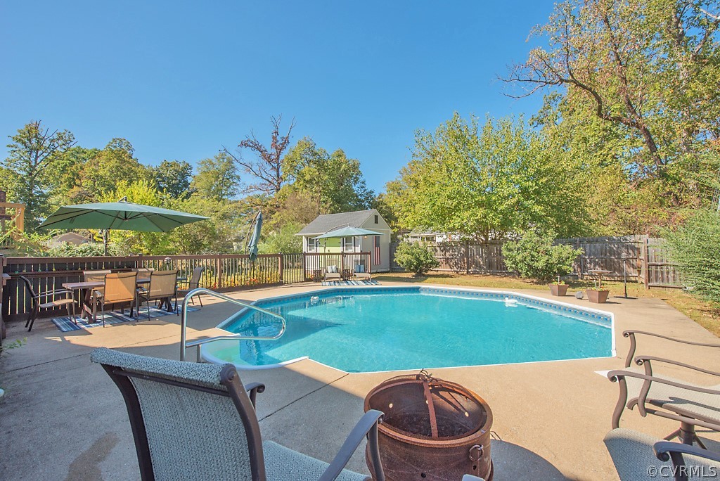 1532 Austin Road Chester, VA 23836 - Photo 40 of 50 a swimming pool with outdoor seating and yard