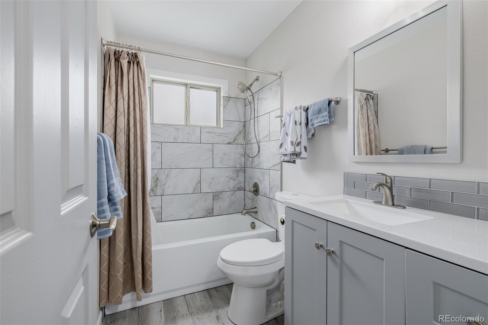 407 Double Tree Drive Greeley, CO 80634 - Photo 25 of 50 a bathroom with a sink toilet and shower