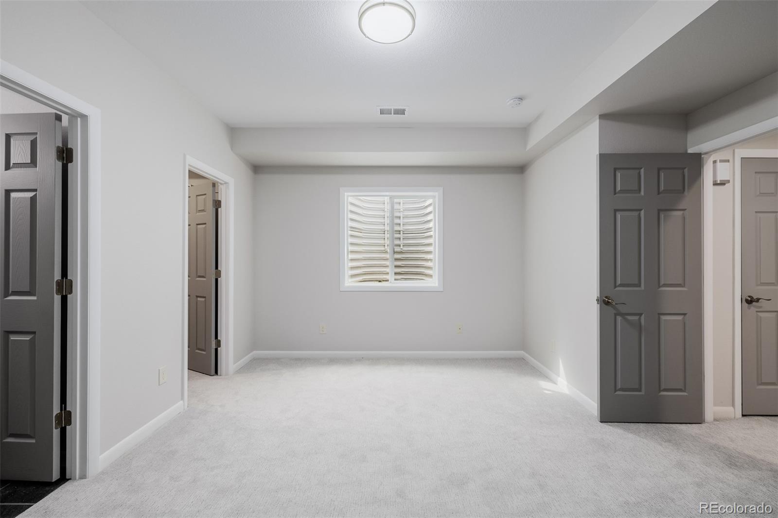407 Double Tree Drive Greeley, CO 80634 - Photo 27 of 50 a view of an empty room with a window