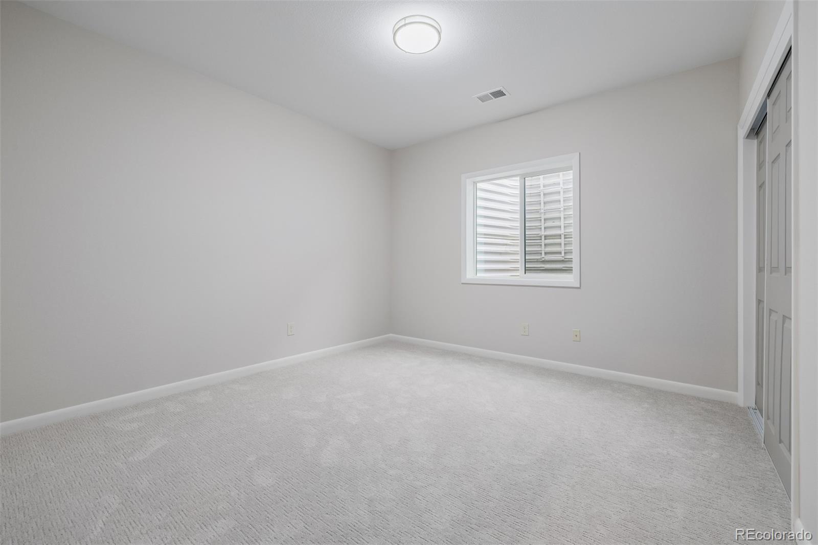 407 Double Tree Drive Greeley, CO 80634 - Photo 29 of 50 an empty room with a window