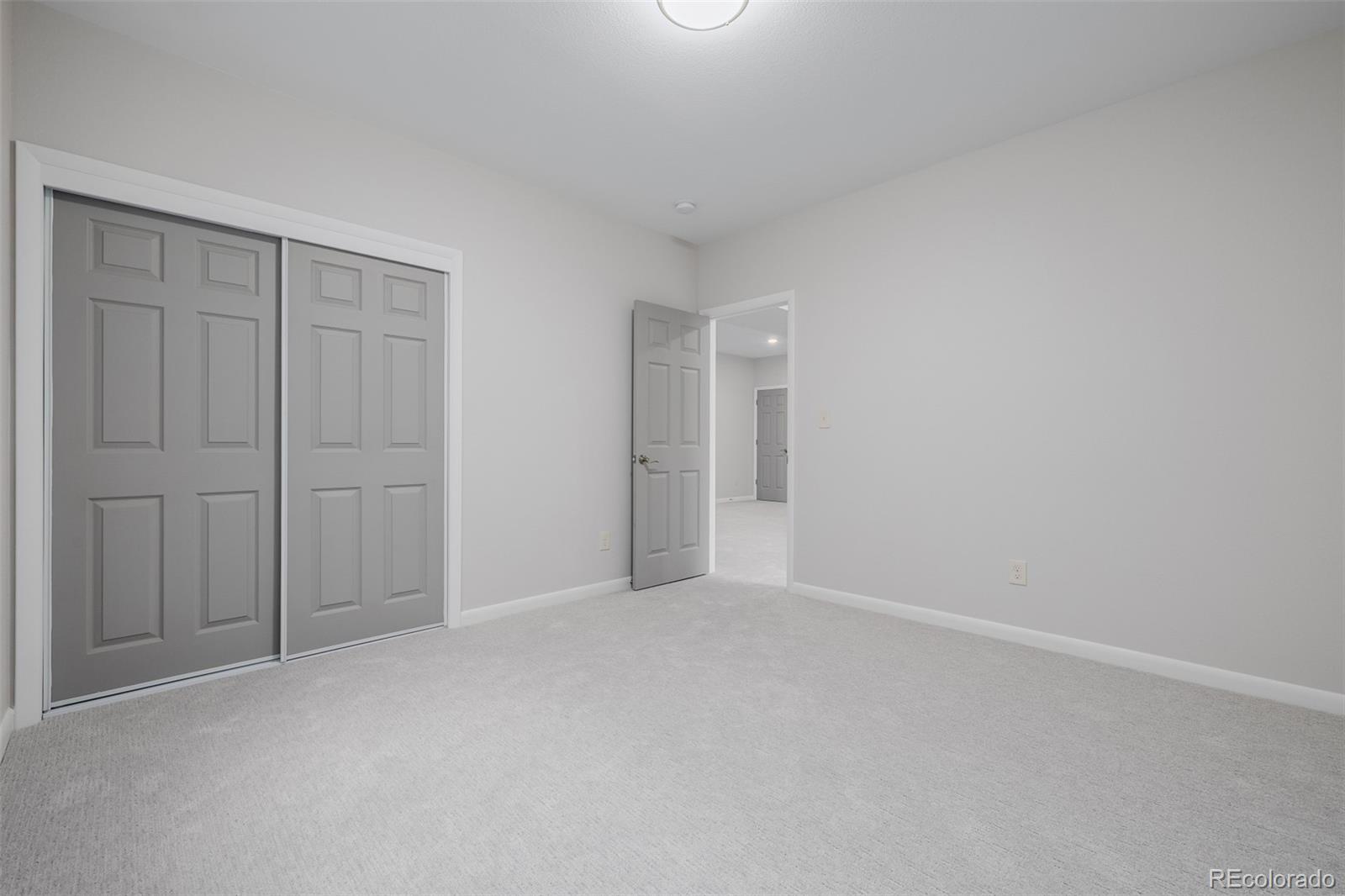407 Double Tree Drive Greeley, CO 80634 - Photo 30 of 50 a view of an empty room and closet area
