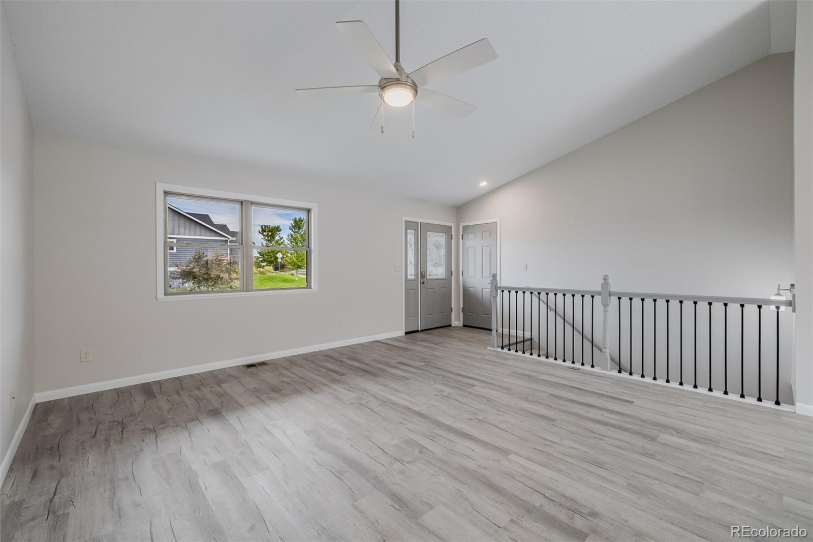 407 Double Tree Drive Greeley, CO 80634 - Photo 34 of 50 a view of an empty room with wooden floor