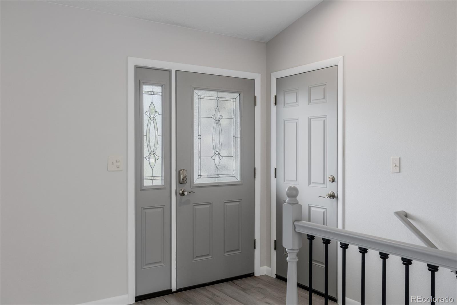 407 Double Tree Drive Greeley, CO 80634 - Photo 35 of 50 a view of a hallway with wooden floor
