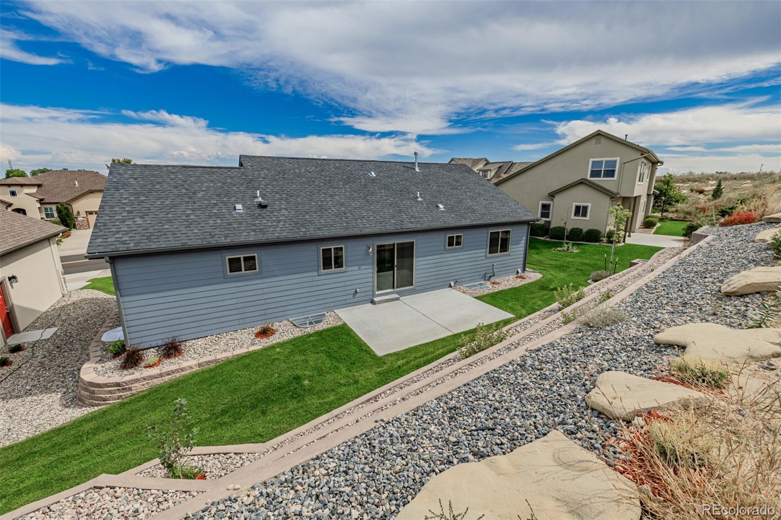 407 Double Tree Drive Greeley, CO 80634 - Photo 47 of 50 a front view of a house with a yard and garage