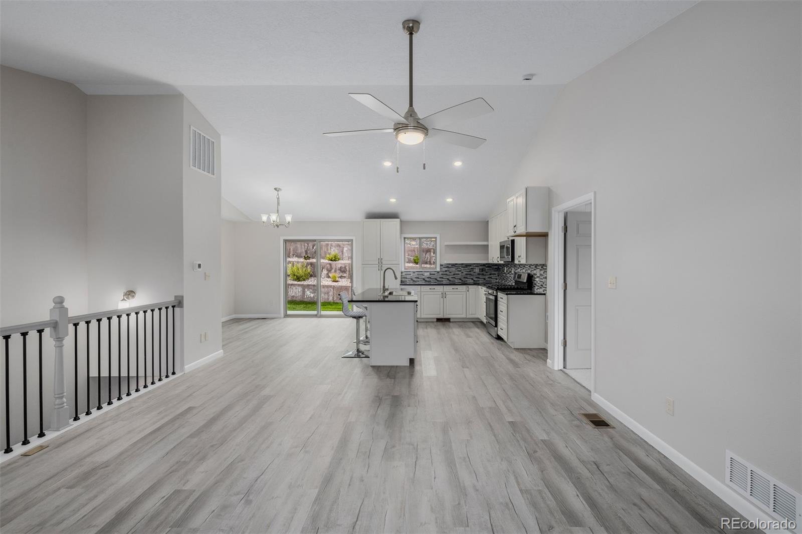 407 Double Tree Drive Greeley, CO 80634 - Photo 6 of 50 a view of a kitchen and an empty room with a window