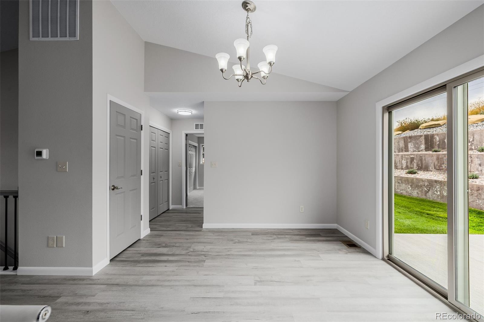 407 Double Tree Drive Greeley, CO 80634 - Photo 8 of 50 wooden floor in an empty room with a window