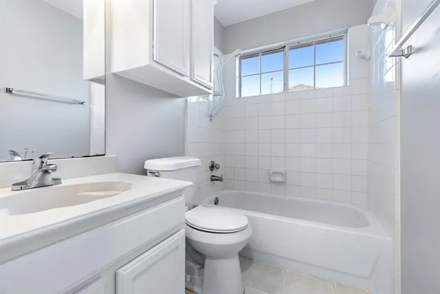 a bathroom with a sink a toilet and a bathtub