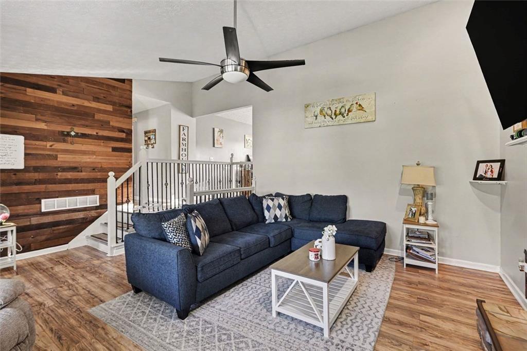 302 Fairview Lane Dallas, GA 30157 - Photo 7 of 26 a living room with furniture and a wooden floor