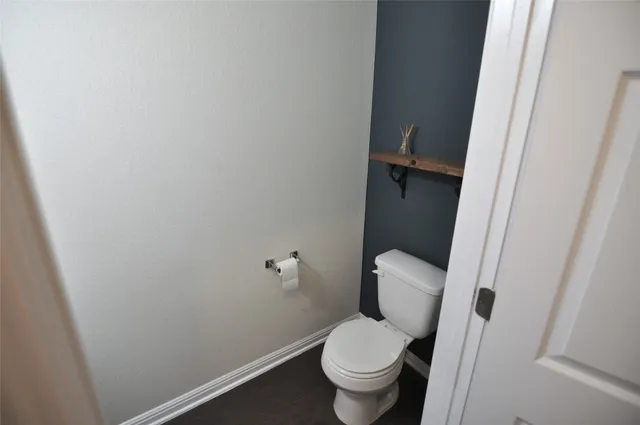 a kitchen with kitchen island granite countertop a sink a counter space appliances and cabinets