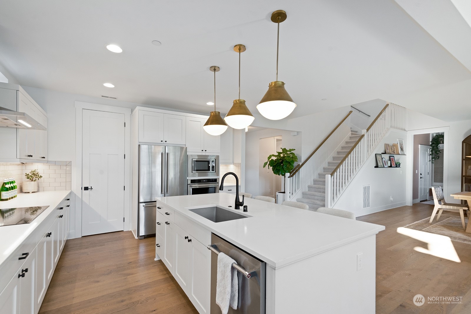 23932 104th Avenue West Edmonds, WA 98020 - Photo 13 of 39 a kitchen with a sink center island and stainless steel appliances