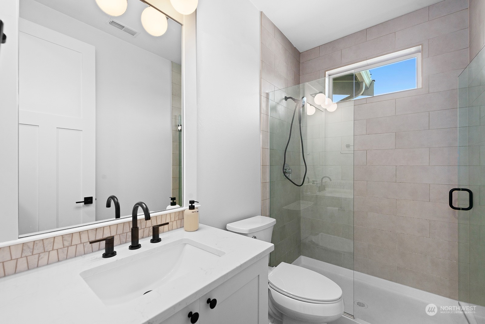 23932 104th Avenue West Edmonds, WA 98020 - Photo 18 of 39 a bathroom with a sink a toilet and shower
