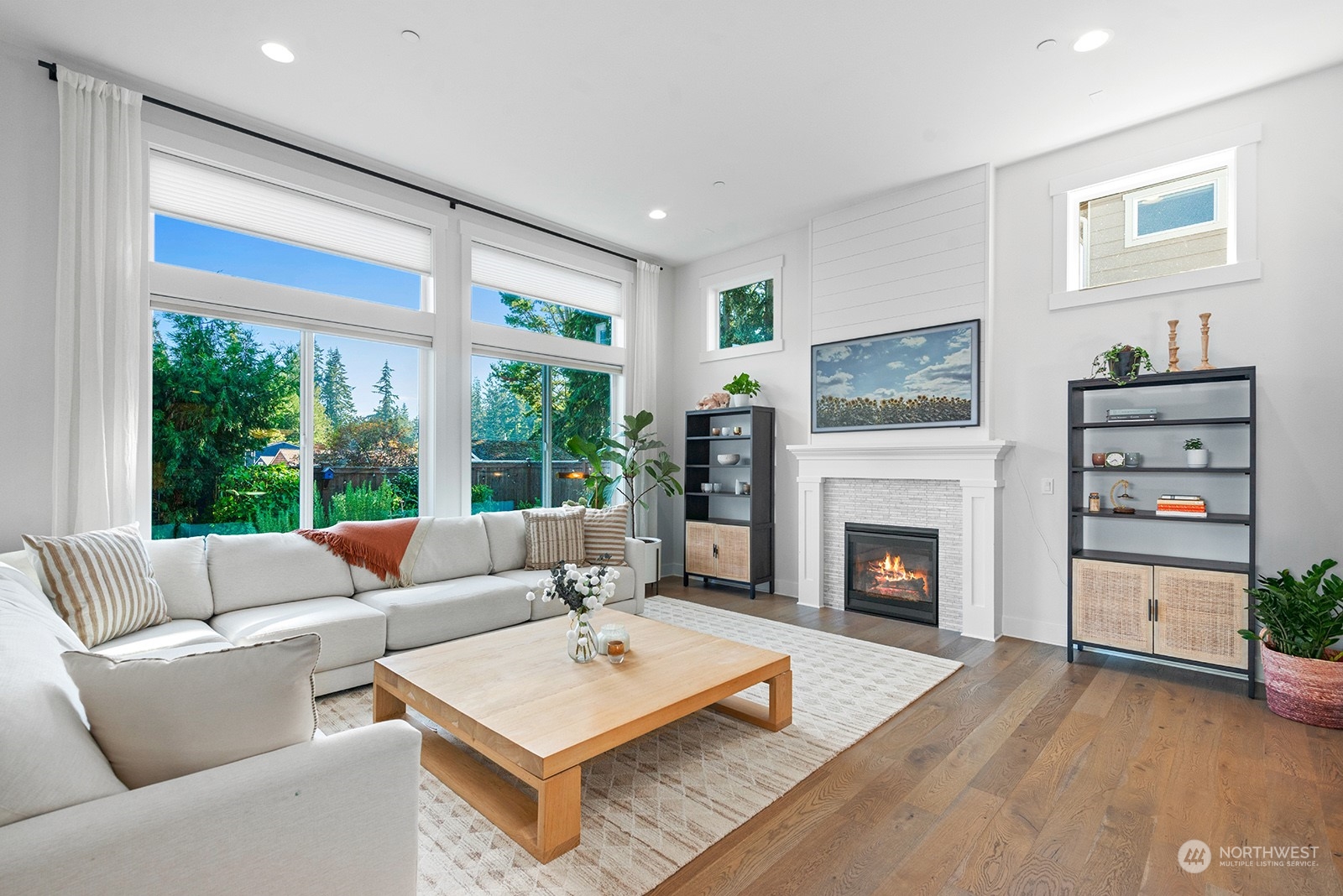 23932 104th Avenue West Edmonds, WA 98020 - Photo 3 of 39 a living room with furniture a fireplace and a large window