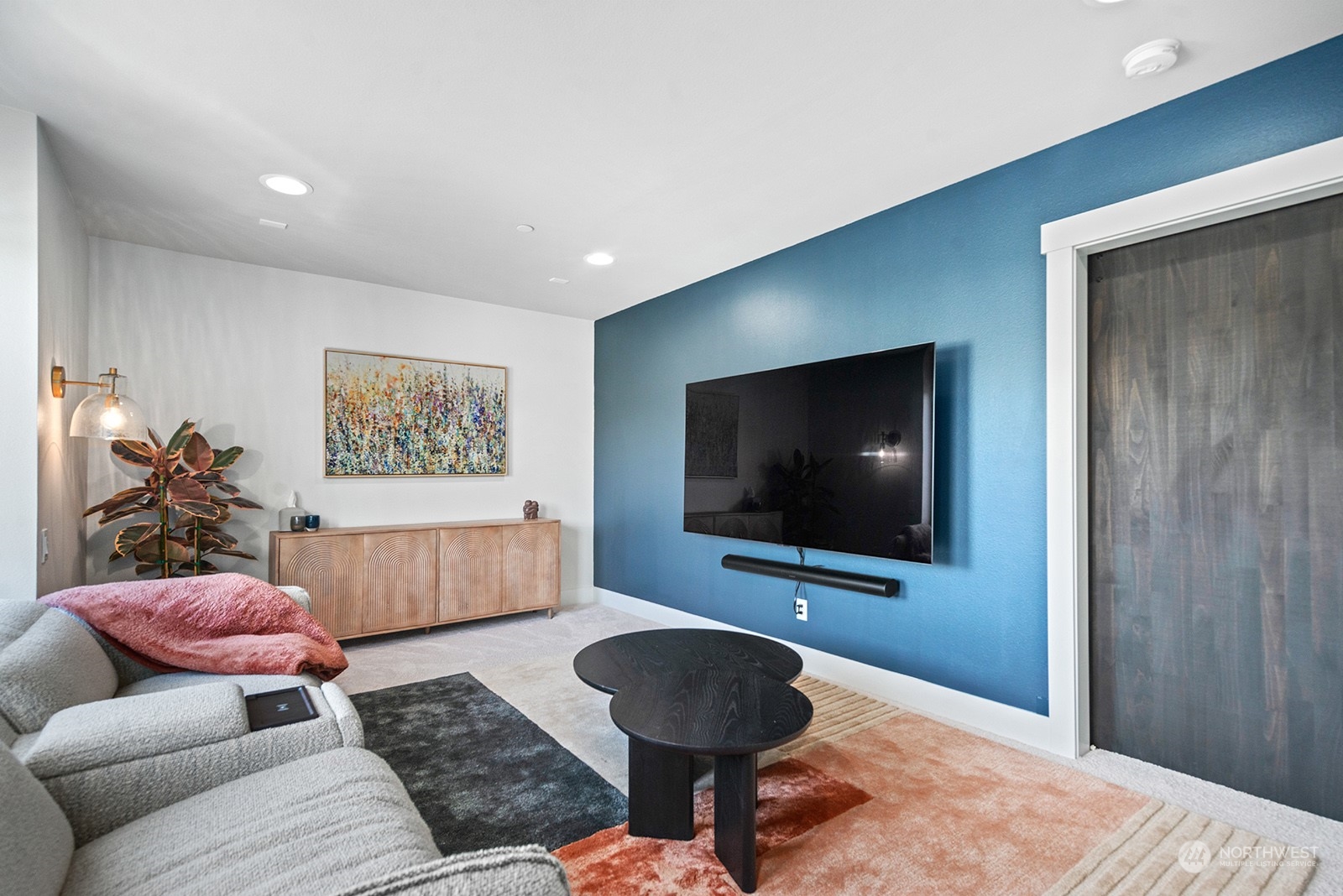 23932 104th Avenue West Edmonds, WA 98020 - Photo 31 of 39 a living room with furniture and a flat screen tv