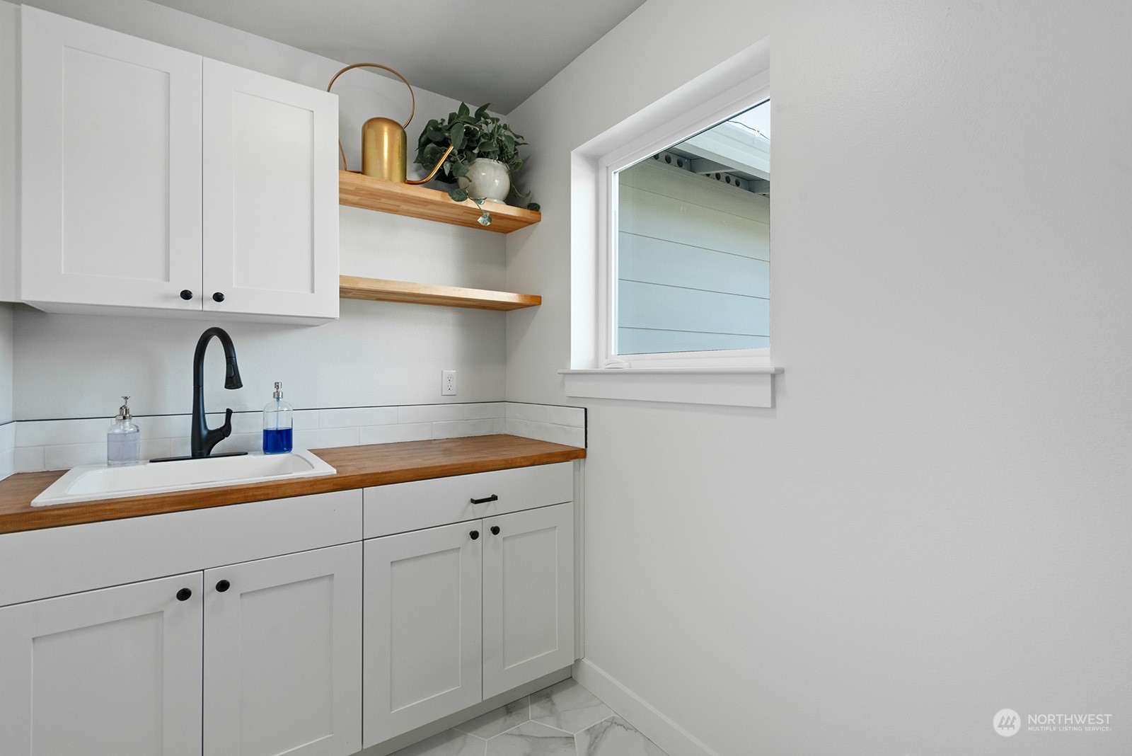 23932 104th Avenue West Edmonds, WA 98020 - Photo 36 of 39 a kitchen with a sink and cabinets