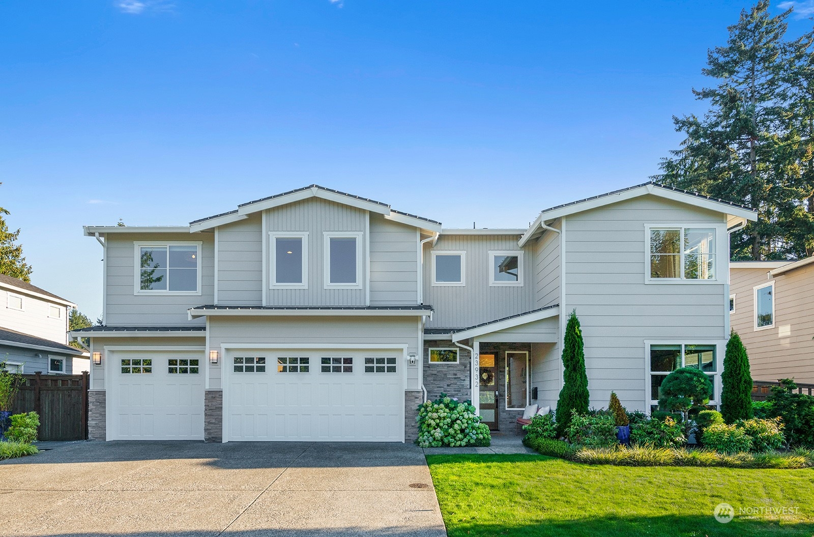 23932 104th Avenue West Edmonds, WA 98020 - Photo 39 of 39 a front view of a house with a garden and garage