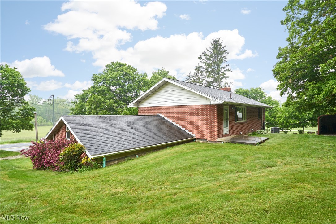 4307 Paxton Road Akron, OH 44321 - Photo 23 of 27 Back yard view - over 1 acre lot goes into tree line