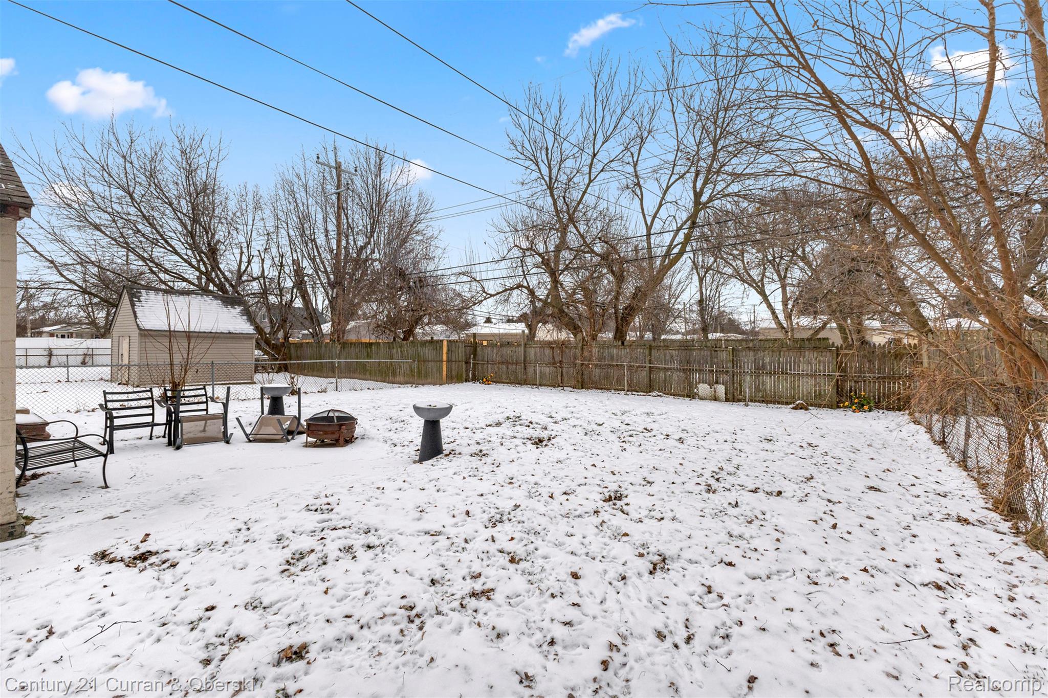 22327 Wick Road Taylor, MI 48180 - Photo 9 of 10 Snowy yard featuring a fenced backyard