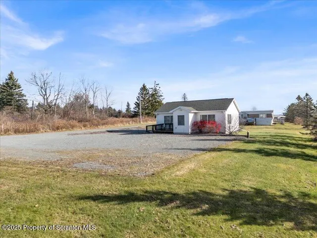a swimming pool view with a lake view