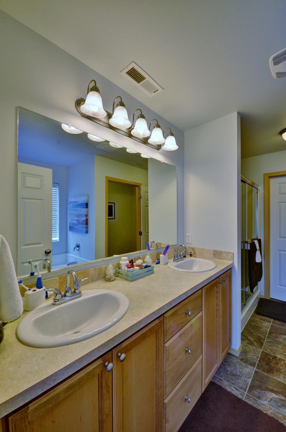 14731 Avalon Road White City, OR 97503 - Photo 21 of 34 a bathroom with a sink double vanity and a mirror