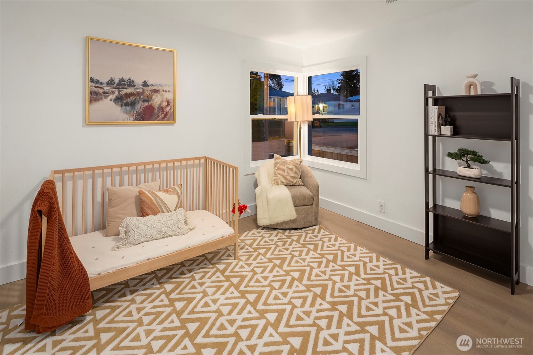 1016 Northwest 85th Street Seattle, WA 98117 - Photo 13 of 36 a bedroom with furniture and wooden floor