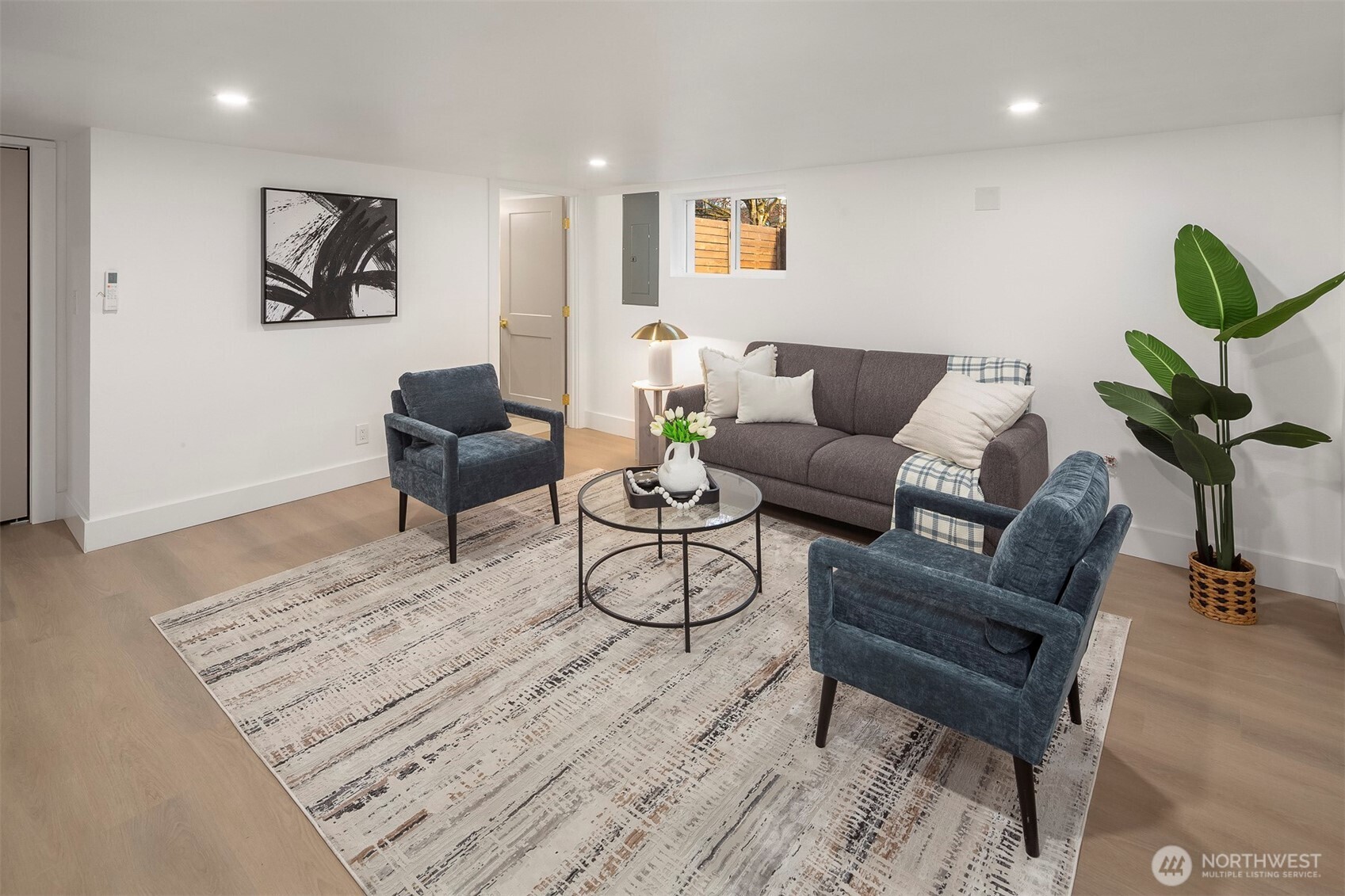 1016 Northwest 85th Street Seattle, WA 98117 - Photo 16 of 36 a living room with furniture and a rug