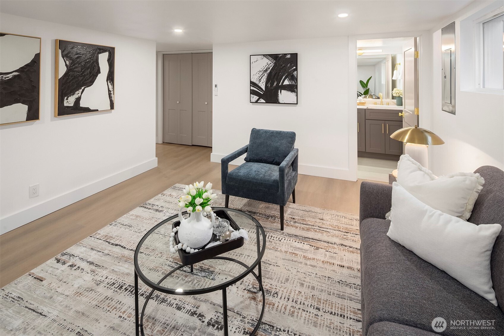 1016 Northwest 85th Street Seattle, WA 98117 - Photo 19 of 36 a living room with furniture and a wooden floor