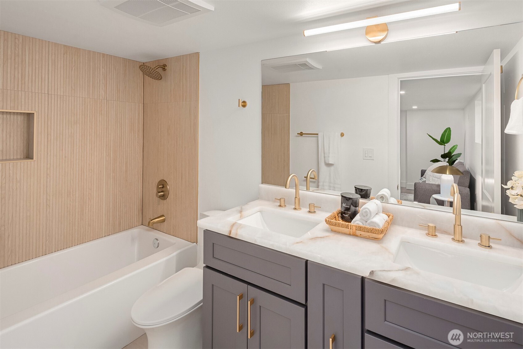 1016 Northwest 85th Street Seattle, WA 98117 - Photo 20 of 36 a bathroom with a tub a sink and a large mirror