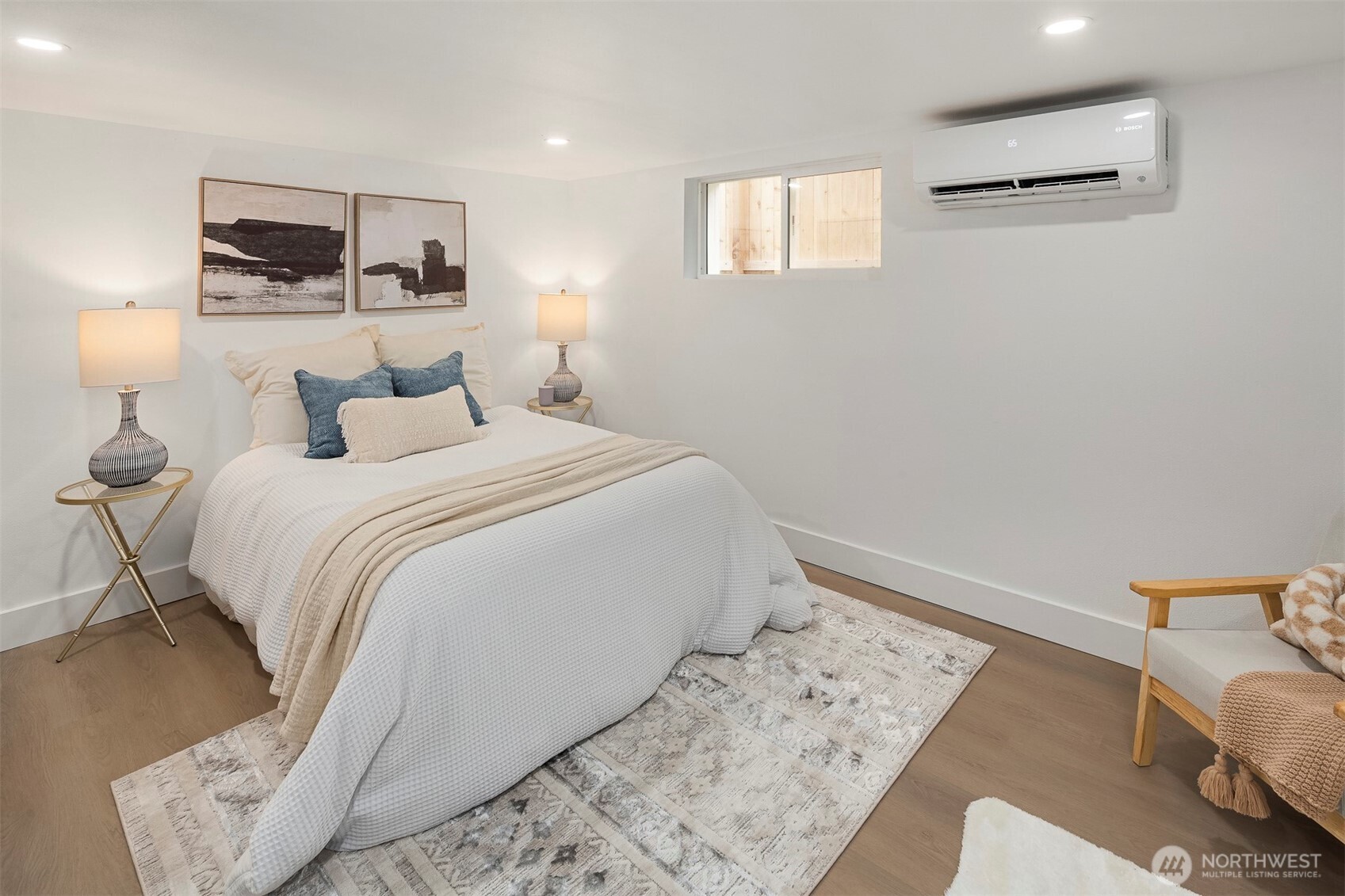 1016 Northwest 85th Street Seattle, WA 98117 - Photo 21 of 36 a bedroom with a bed and a couch