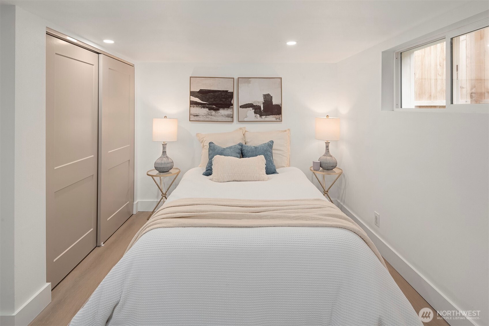 1016 Northwest 85th Street Seattle, WA 98117 - Photo 22 of 36 a bedroom with a bed and a night stand