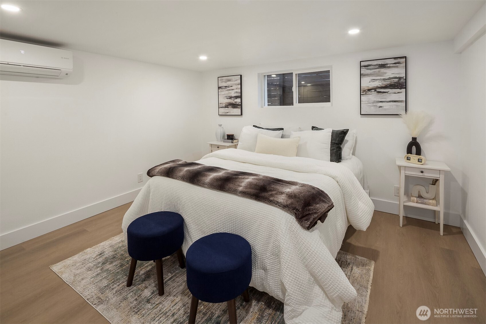 1016 Northwest 85th Street Seattle, WA 98117 - Photo 23 of 36 a bedroom with a bed and wooden floor