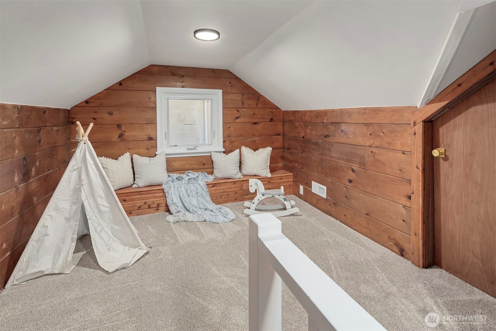 1016 Northwest 85th Street Seattle, WA 98117 - Photo 24 of 36 a living room with furniture and a fireplace