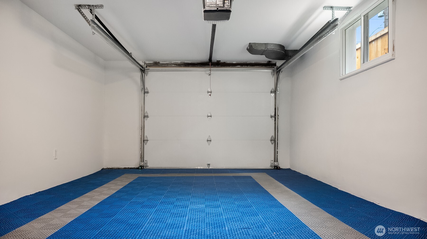 1016 Northwest 85th Street Seattle, WA 98117 - Photo 27 of 36 a view of an empty room with wooden floor