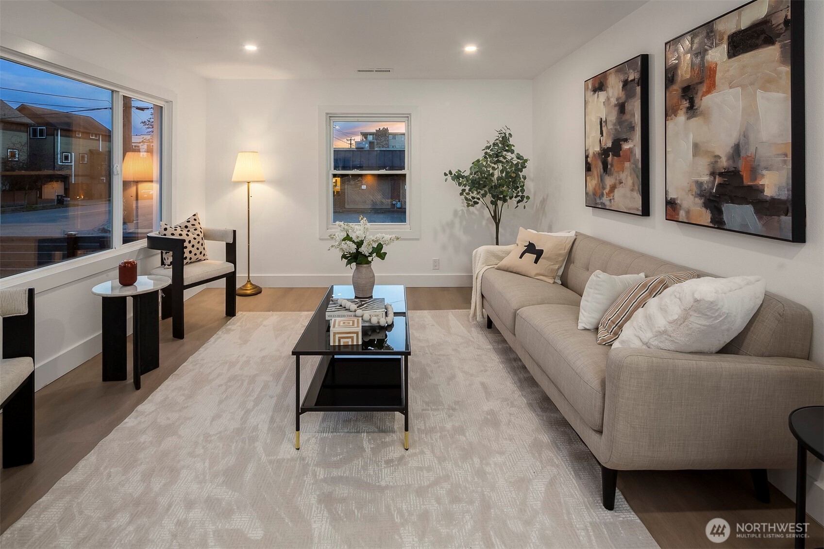 1016 Northwest 85th Street Seattle, WA 98117 - Photo 4 of 36 a living room with furniture kitchen view and a large window