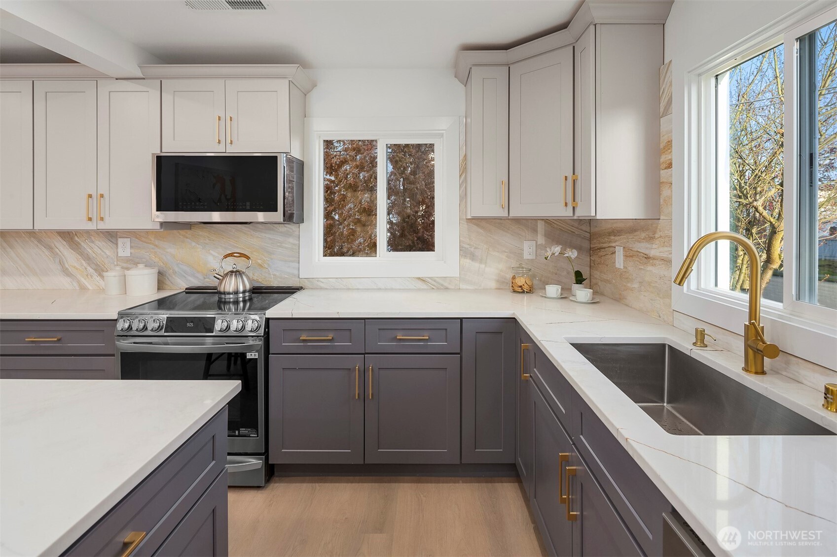 1016 Northwest 85th Street Seattle, WA 98117 - Photo 8 of 36 a kitchen with a sink stove and microwave