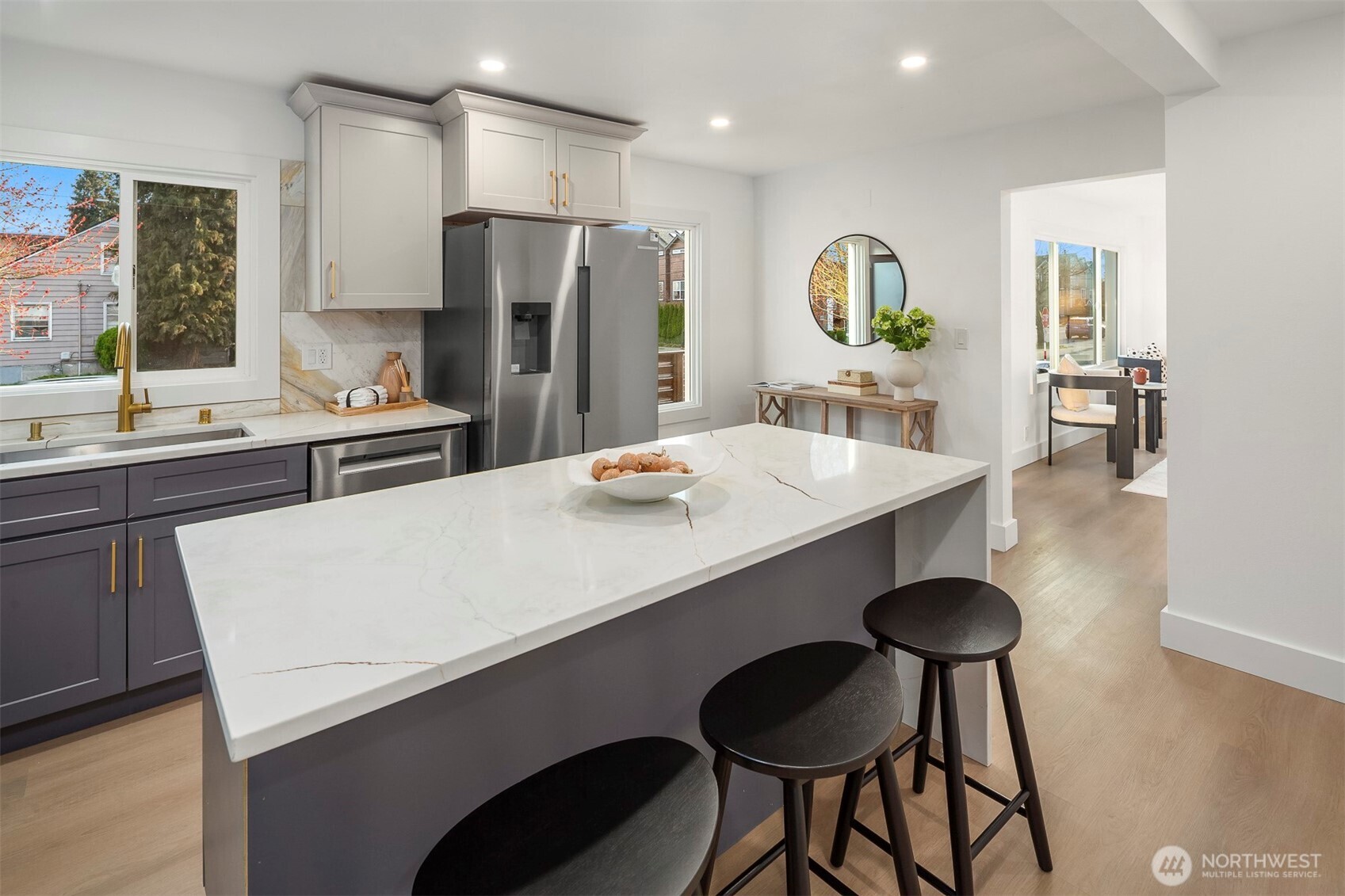 1016 Northwest 85th Street Seattle, WA 98117 - Photo 9 of 36 a large kitchen with sink and refrigerator