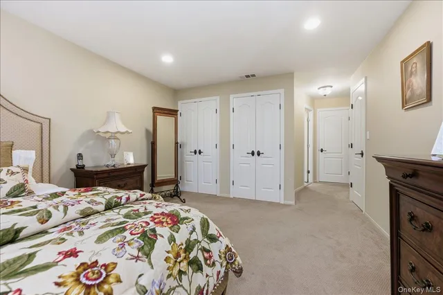 a bedroom with a bed and a cabinets