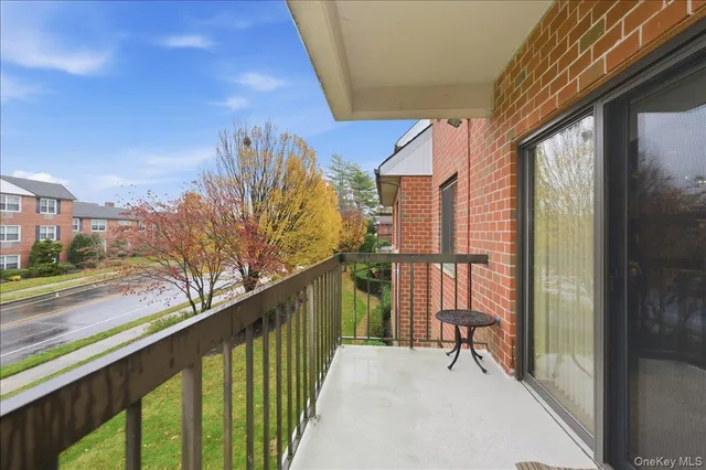 a balcony with view of outdoor space